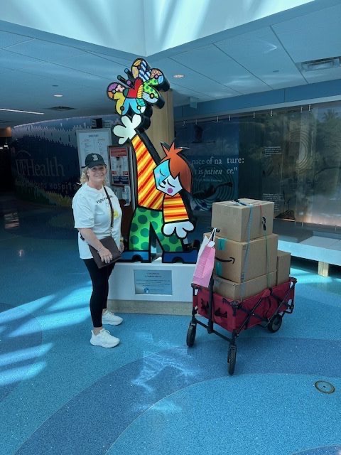 Volunteer at UF Health with Britto giraffe statue